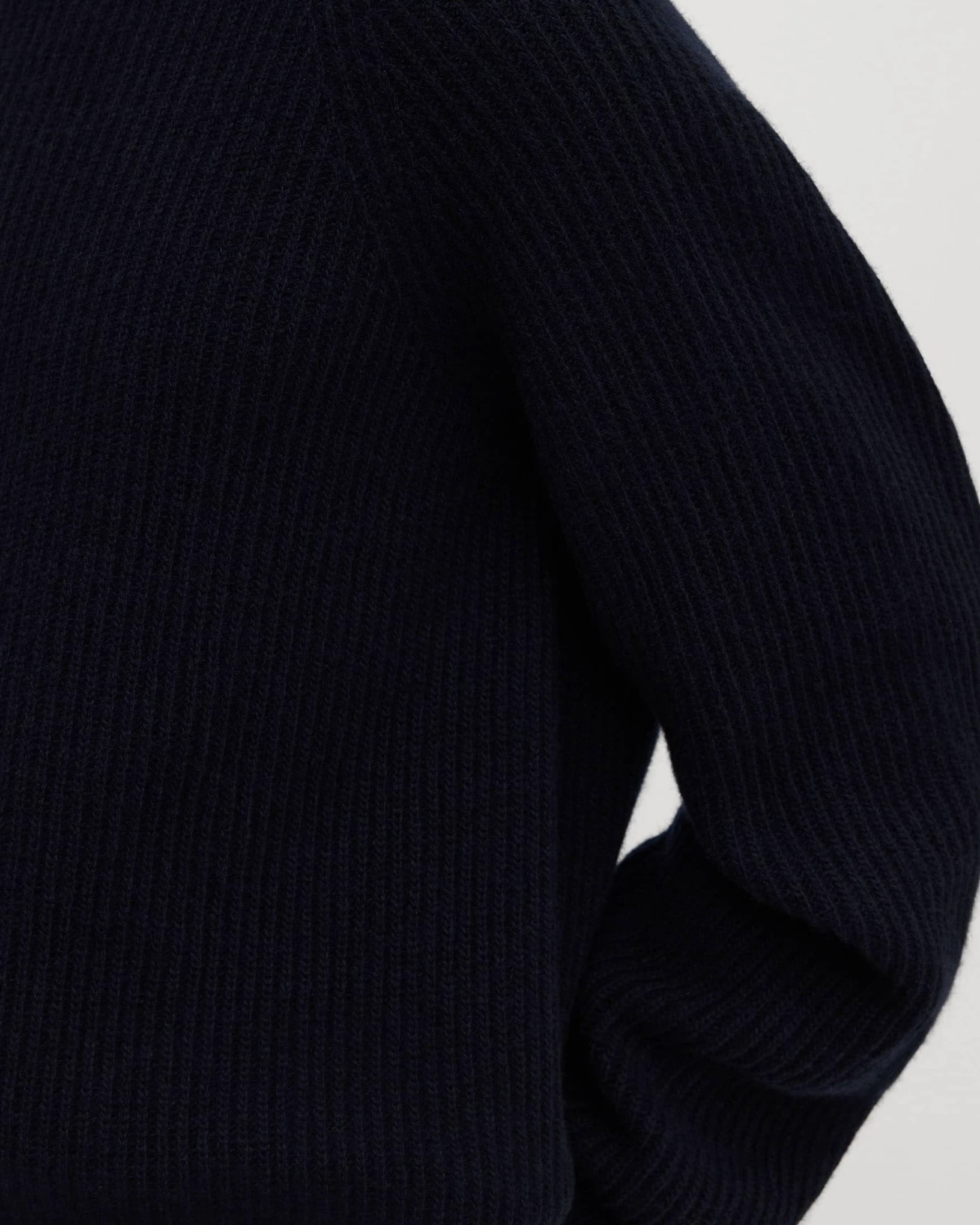 Close view of the rib knit on an Asket Heavy Wool Sweater sleeve